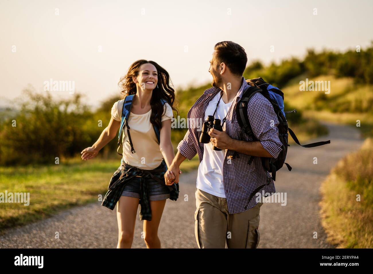 Happy couple is hiking in mountain. Stock Photo