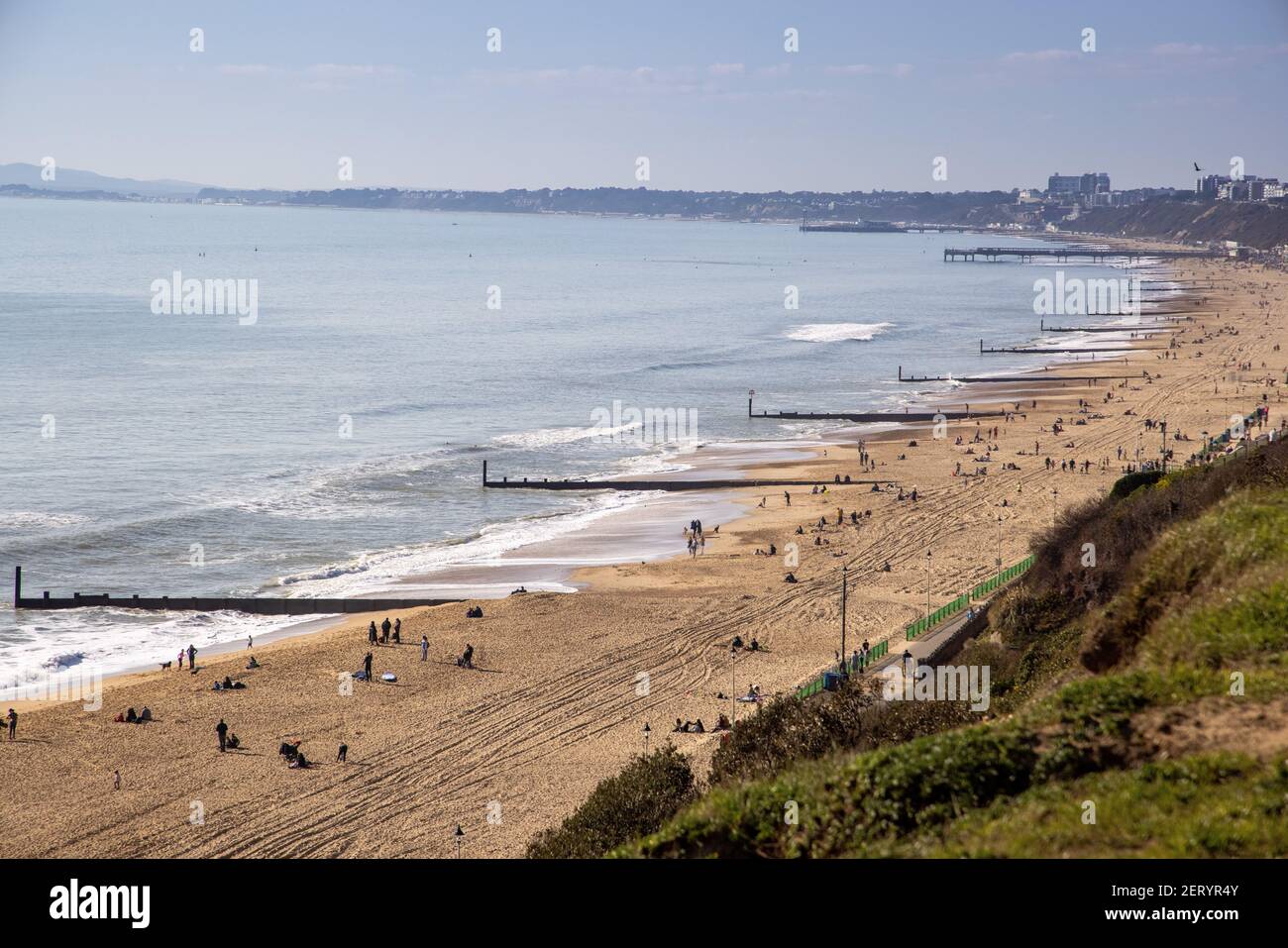 A view towards Boscombe and Bournemouth Piers over the beach at Fisherman’s Walk, Southbourne, Bournemouth on a beautifully sunny February day during Stock Photo