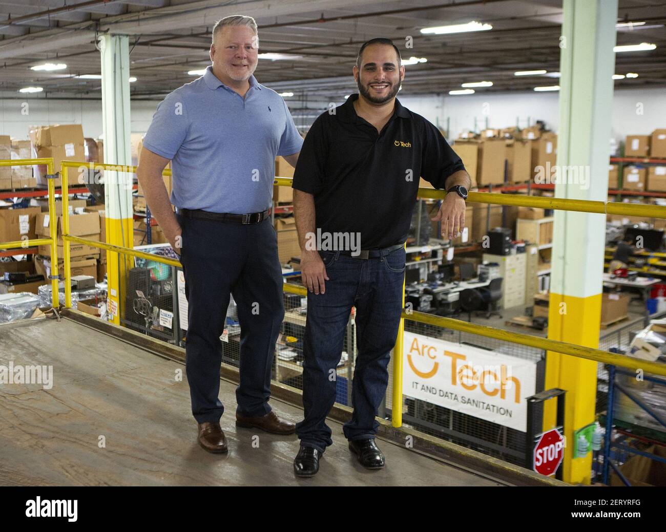 Brian Ouellette, vice president of Social Enterprises, left, and Tomas  Leon, director of Arc Tech, work from their warehouse space in Fort  Lauderdale, Fla. on Friday, Oct. 5, 2018. Arc Tech, one