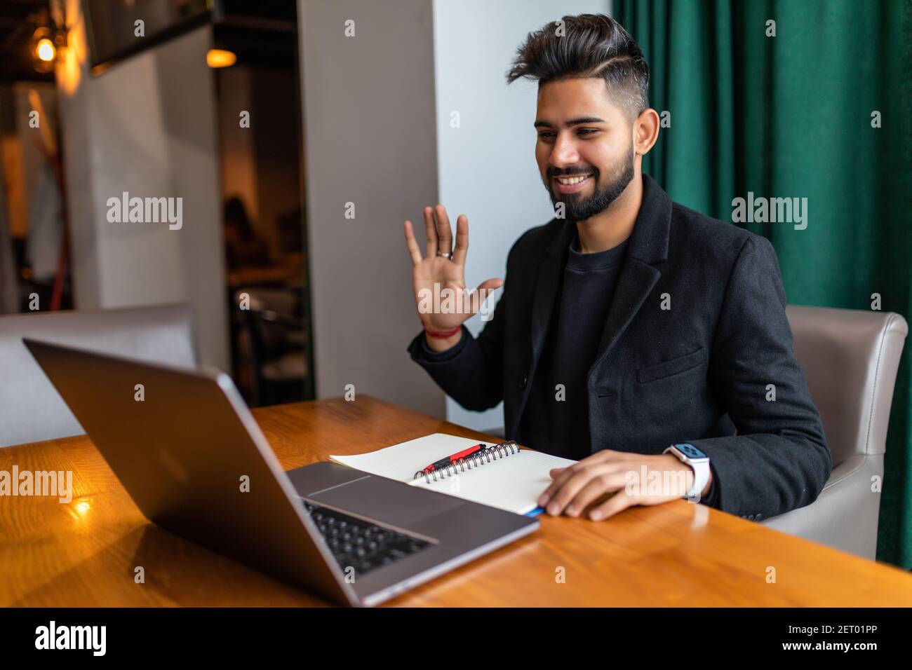 Young asian man using laptop make video call in cafe Stock Photo - Alamy