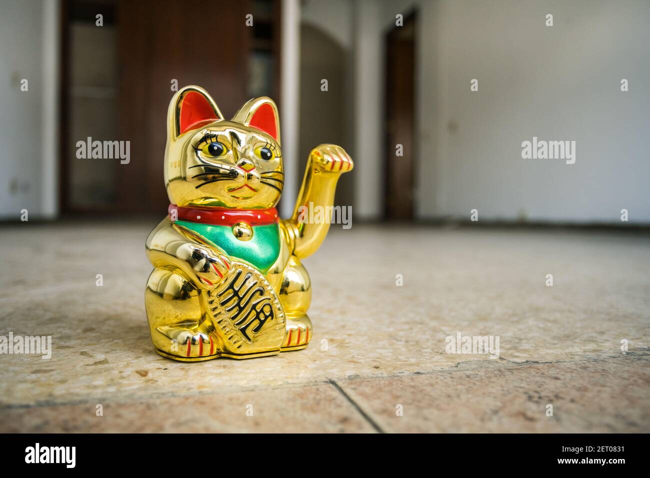 Japanese cat symbolism prosperity in empty house home for sale. Real estate market recovery investing mortgage hope to buy Stock Photo