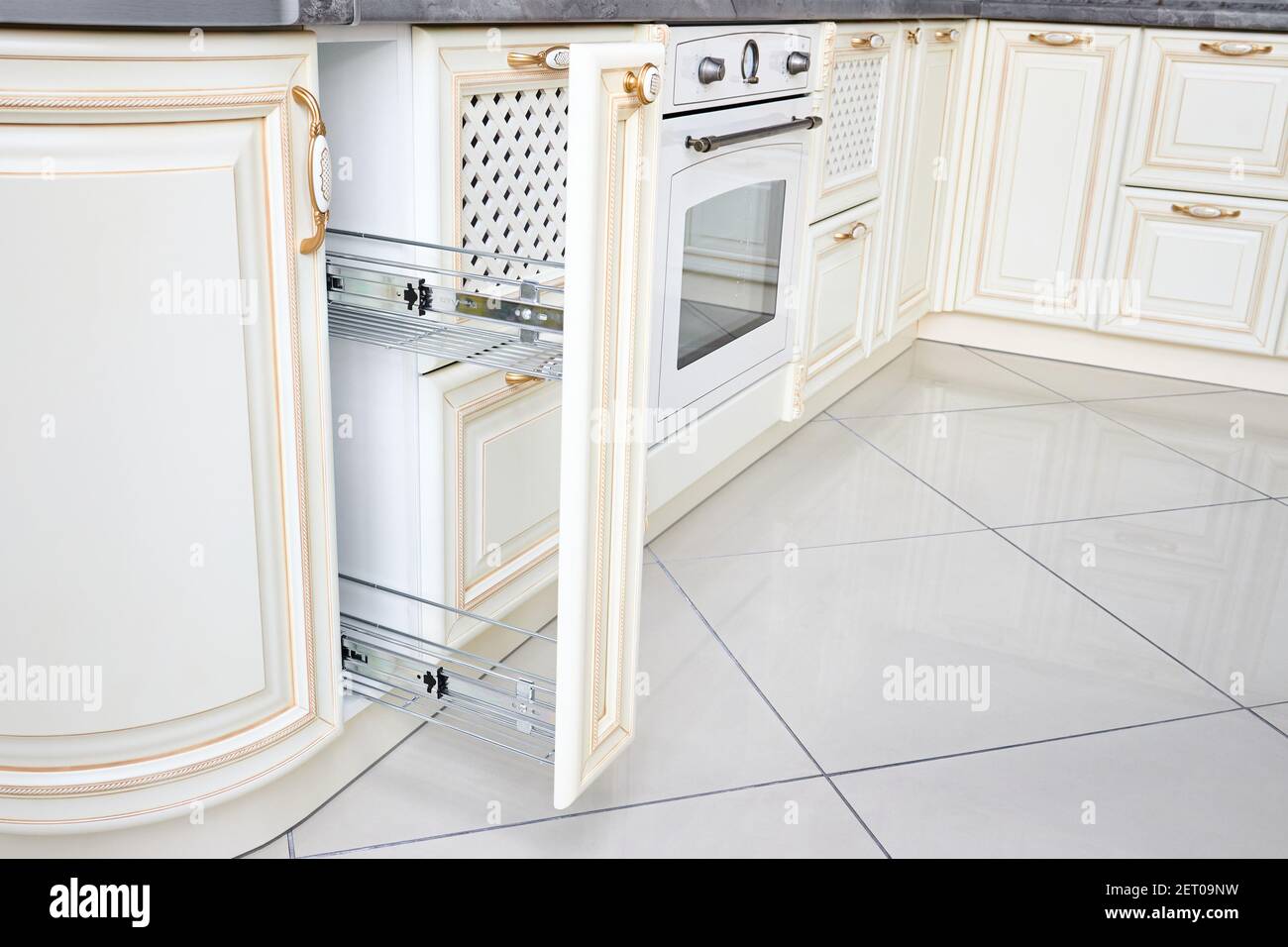 Pull out spice rack filler pantry. Interior of modern kitchen