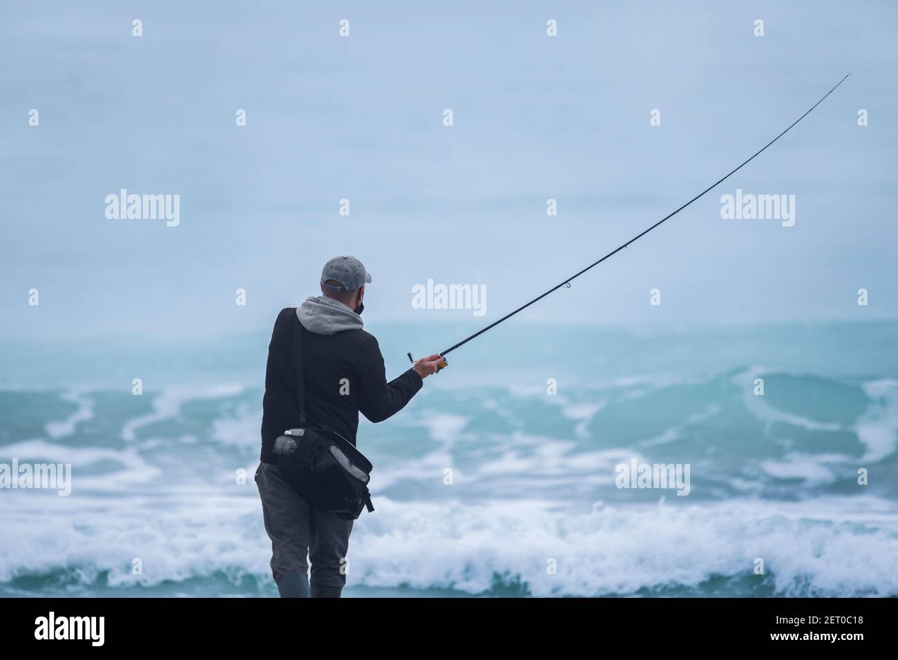 Back shot of an angler about to cast the line Stock Photo
