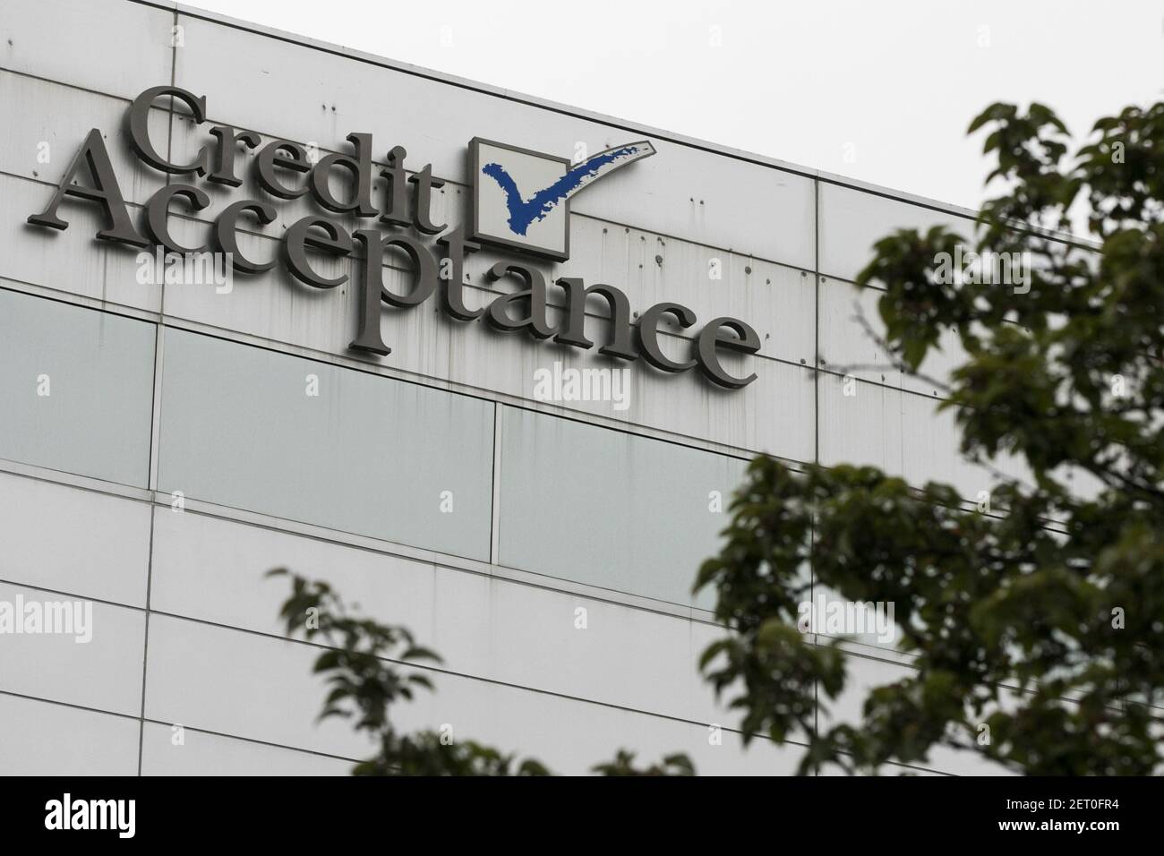 A logo sign outside of the headquarters of the Credit Acceptance