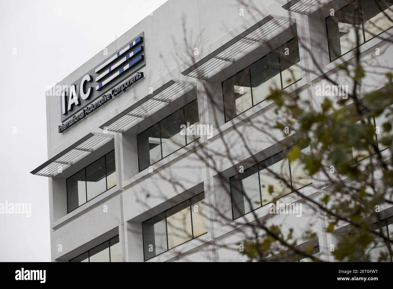 A logo sign outside of a facility occupied by International Automotive