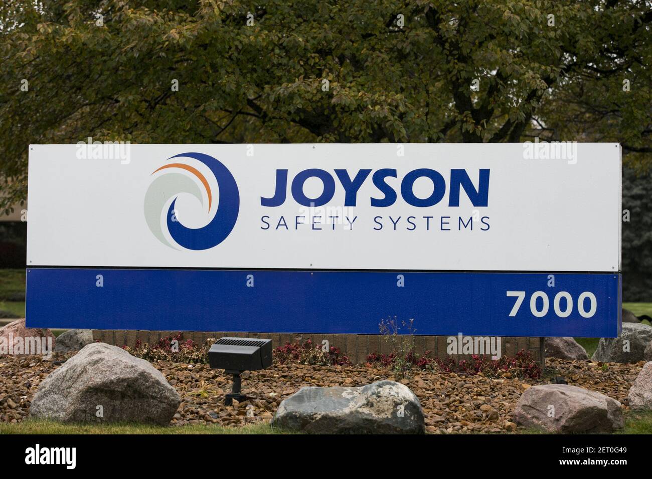 A logo sign outside of a facility occupied by Joyson Safety Systems in