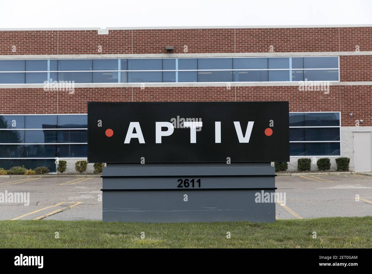 A logo sign outside of a facility occupied by Aptiv PLC in Auburn Hills ...