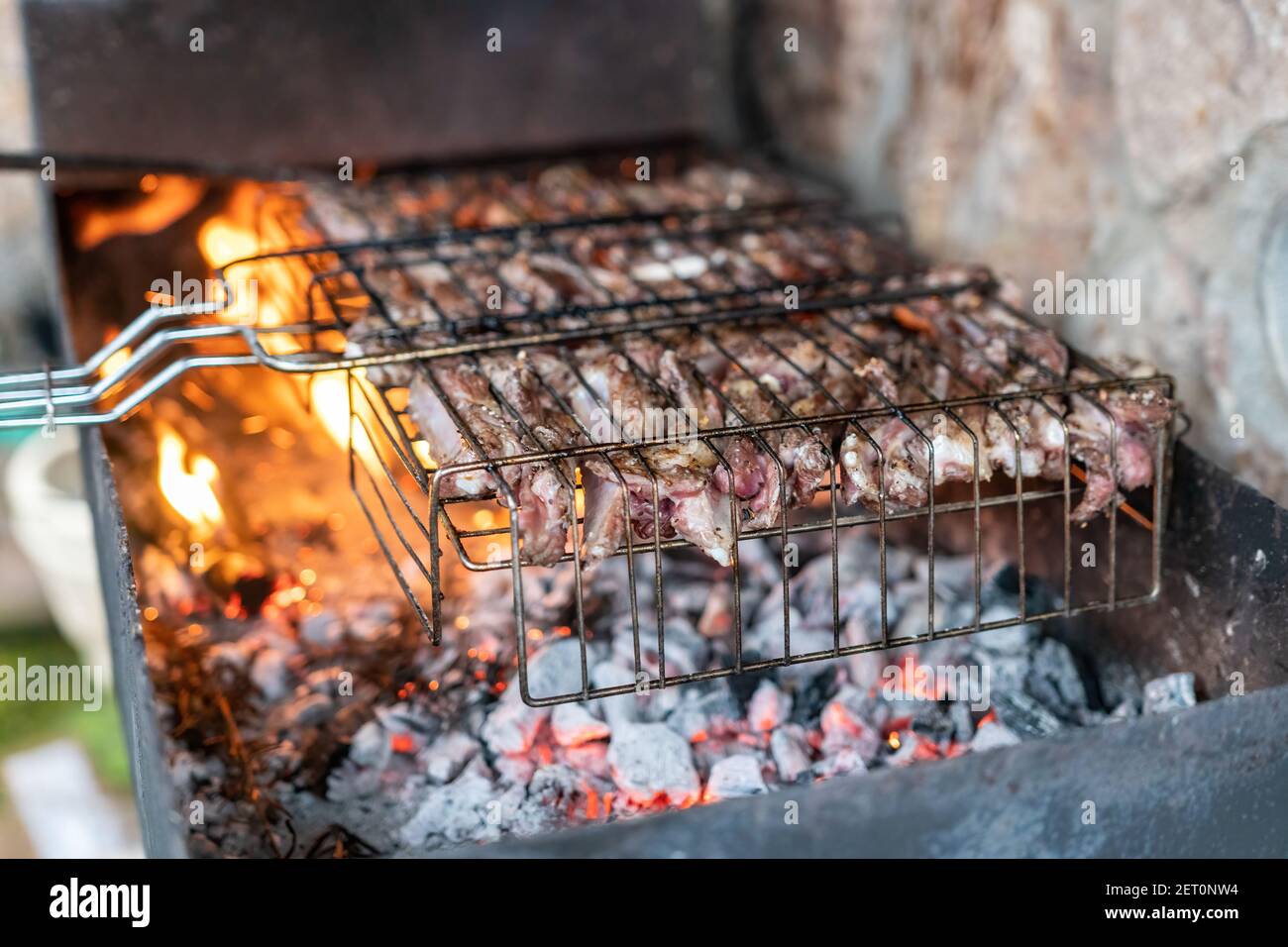 Lamb ribs cooked over an open fire, closeup. Lamb chops Grilling