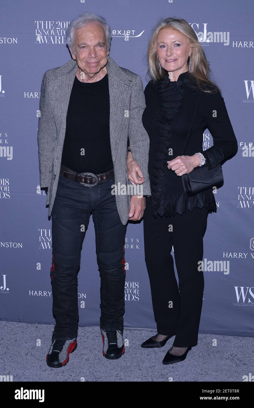 Fashion designer Ralph Lauren (L) kisses his wife Ricky Lauren on