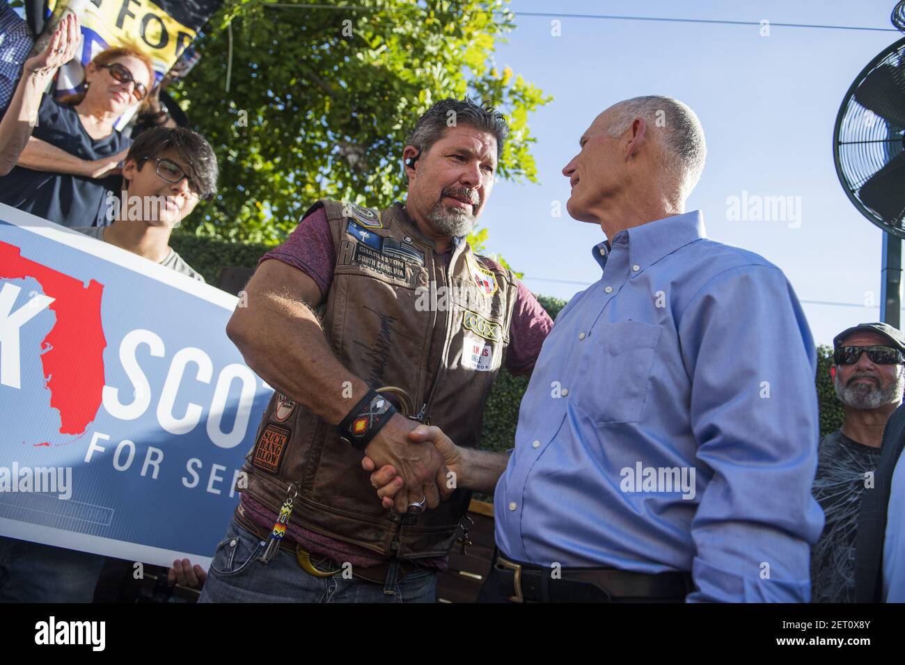 UNITED STATES - NOVEMBER 4: Florida Gov. Rick Scott (R), right, who is running for the U.S. Senate, talks with Chris Cox, founder of Bikers for Trump, during a rally hosted by the group at the 27 Bar & Lounge in Fort Lauderdale on November 4, 2018. (Photo By Tom Williams/CQ Roll Call) Stock Photo