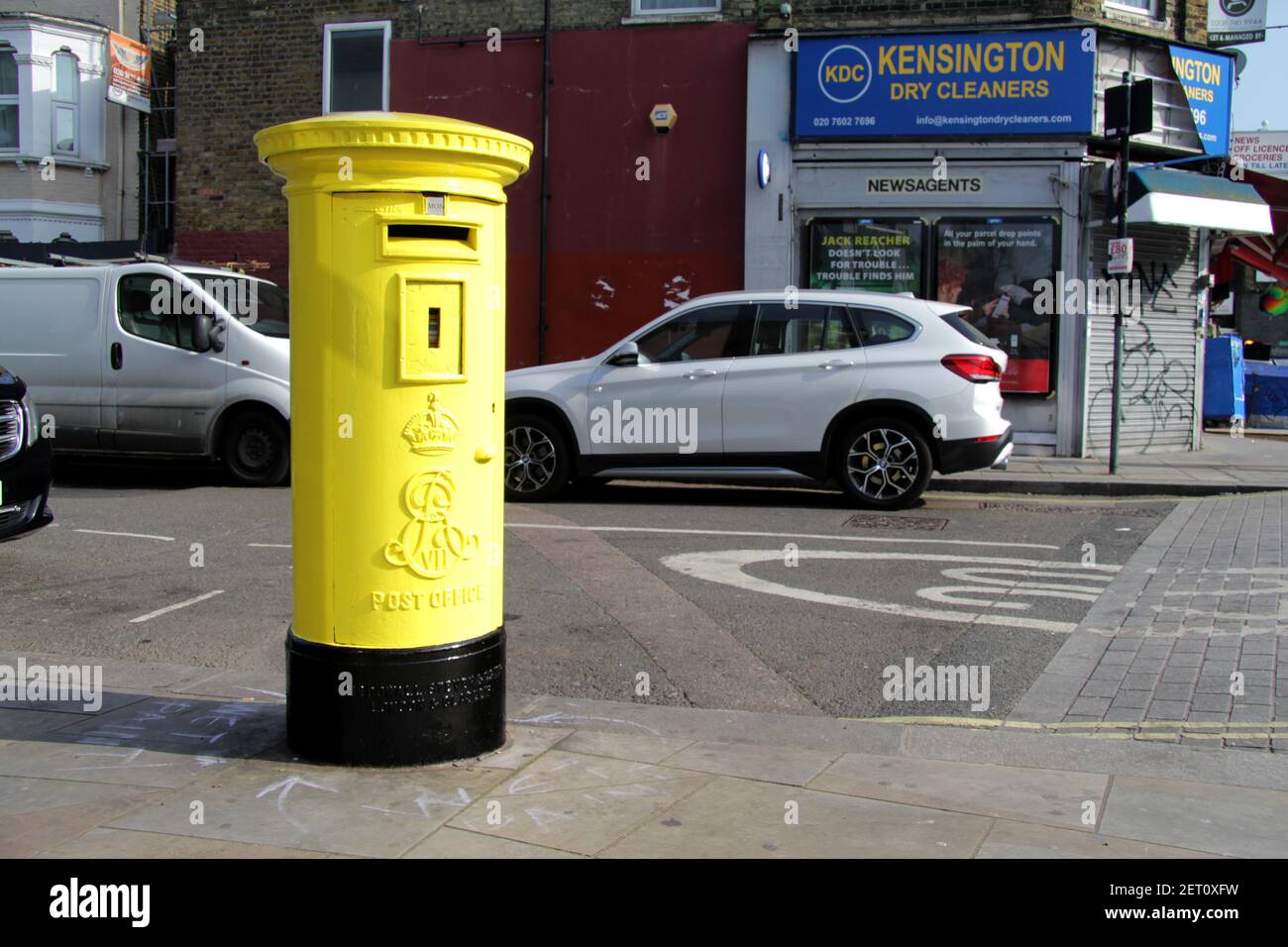Yellow Royal Mail Postbox in West London Street Stock Photo