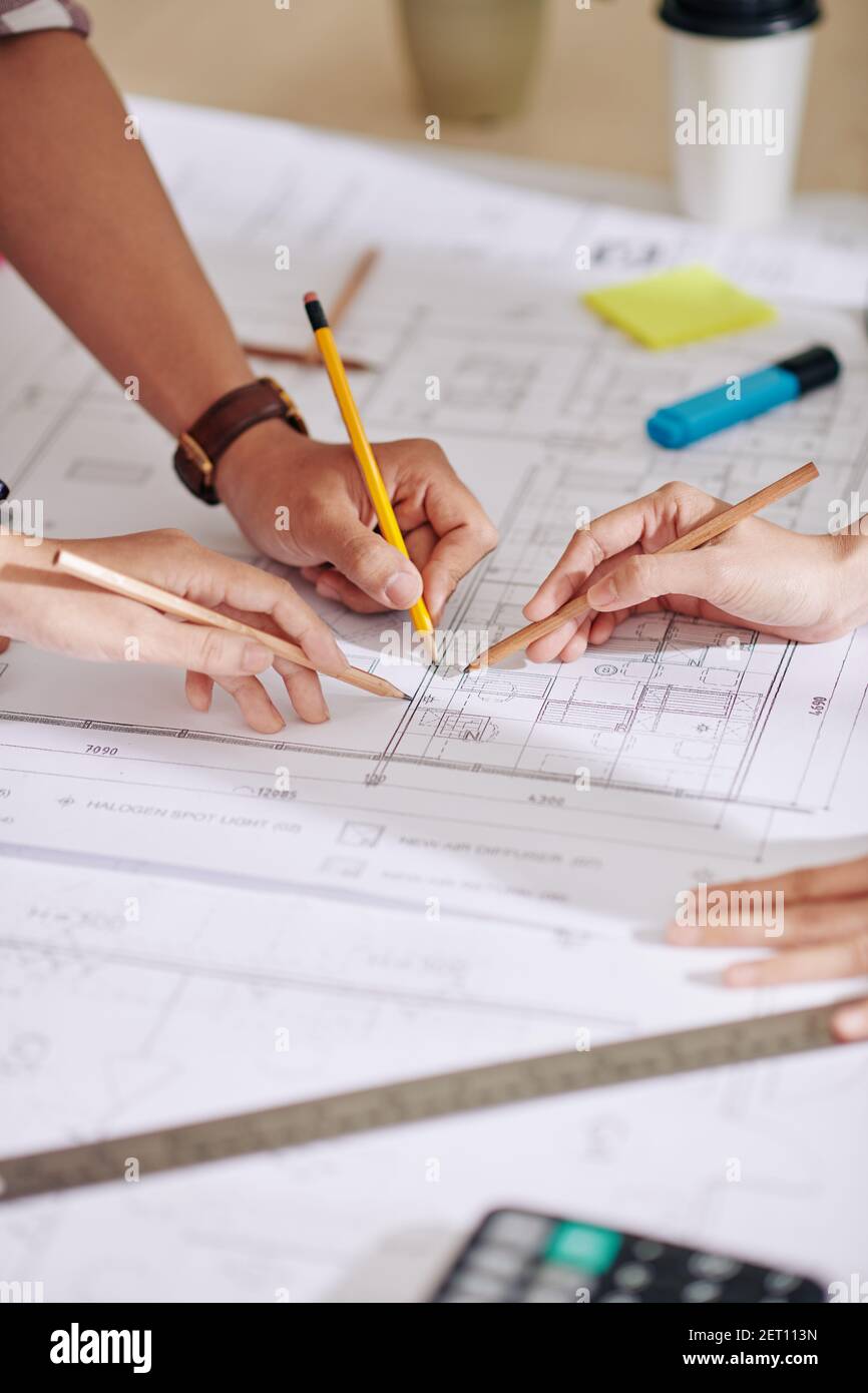 Construction engineers discussing construction plan Stock Photo