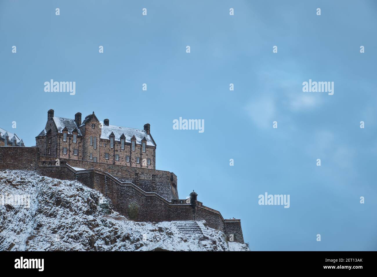 Old Scottish castle on a rock covered with snow in winter. View of Edinburgh Castle, Edinburgh, Scotland, United Kingdom Stock Photo