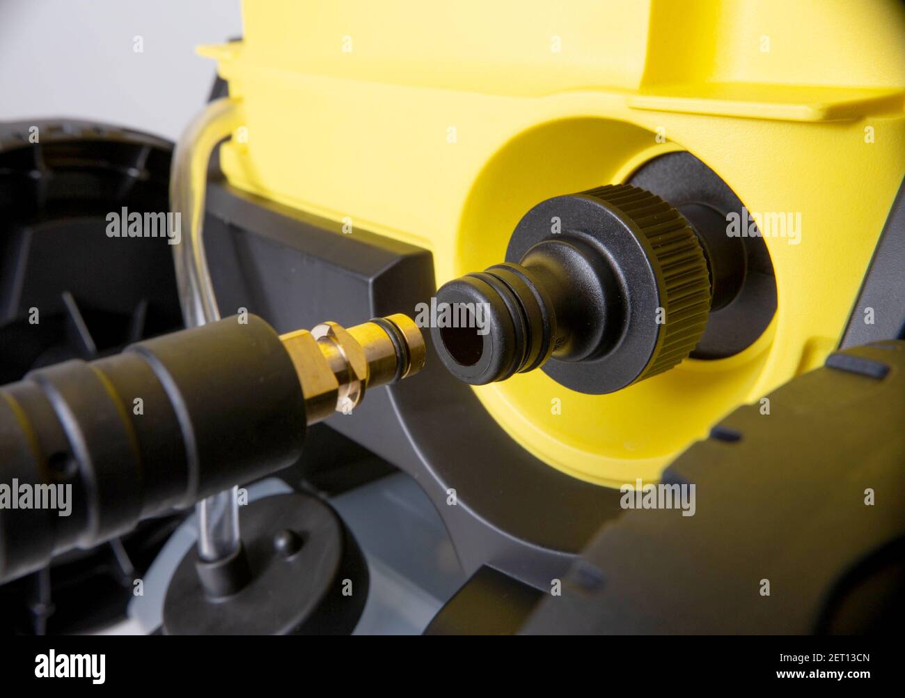 Connecting the pressure washer to a tap water hose, closeup Stock