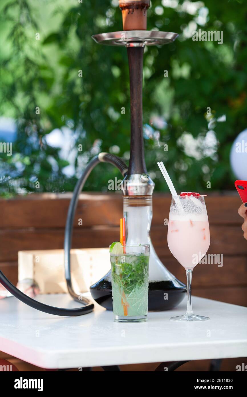 Alcoholic drink cocktail and hookah on the street Stock Photo Alamy