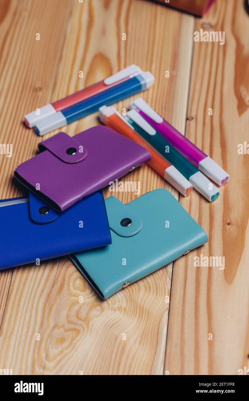 stationery business card holder colorful markers office desktop Stock Photo Alamy