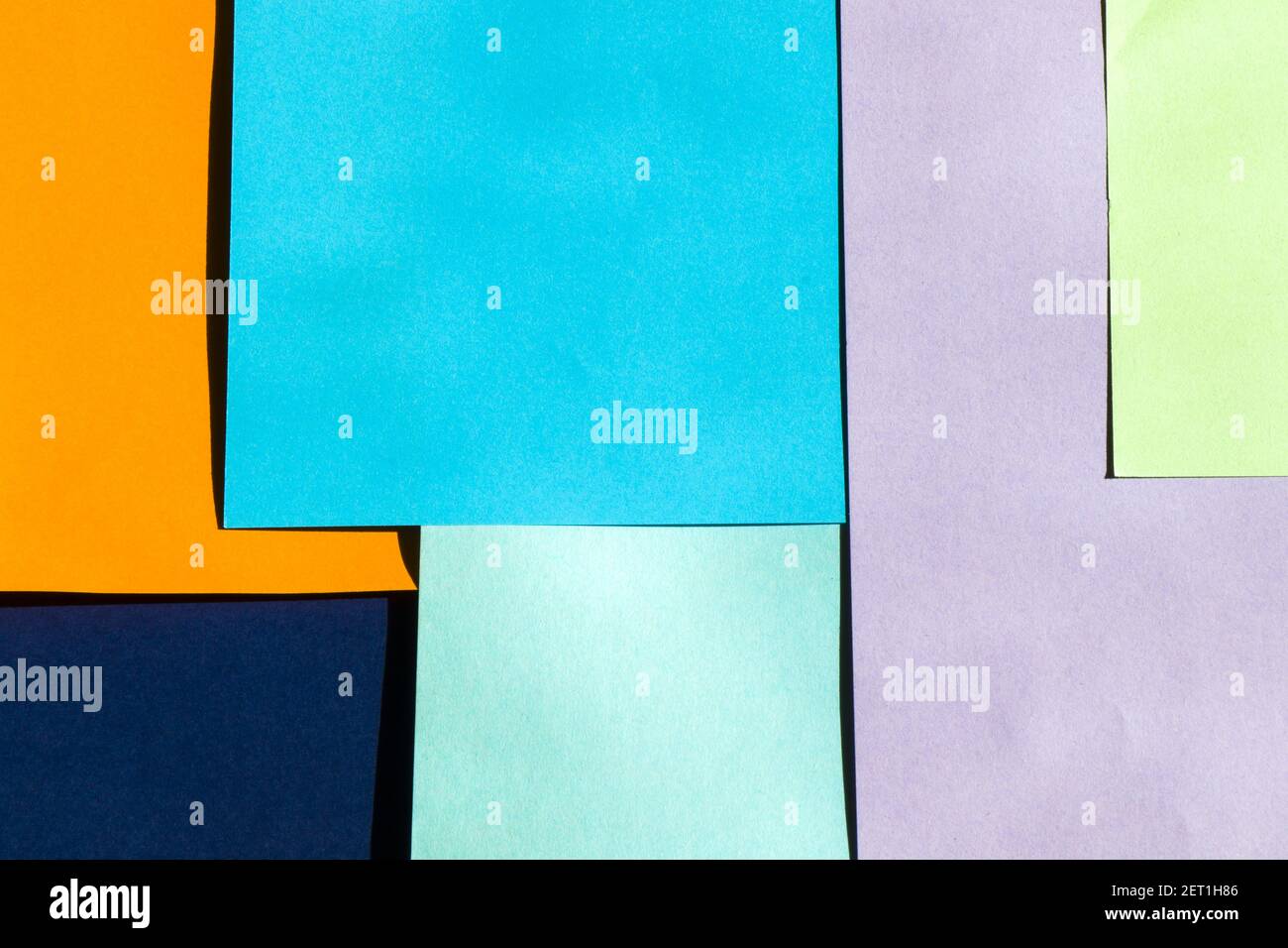 The colorful paper background, paper board and geometric figures ...