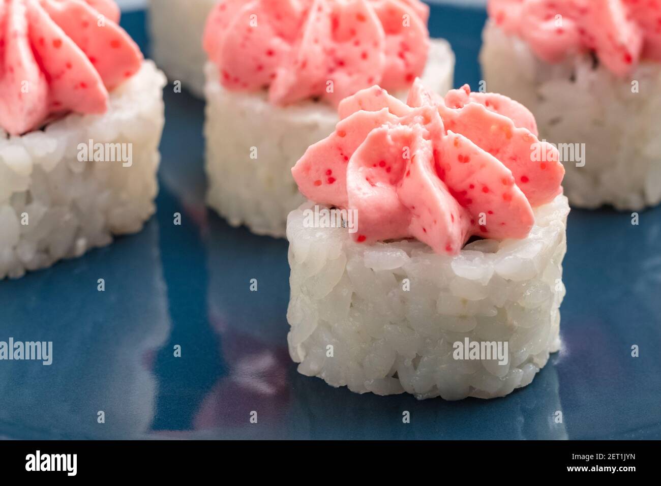rolls on a blue plate. Serving Japanese food Stock Photo
