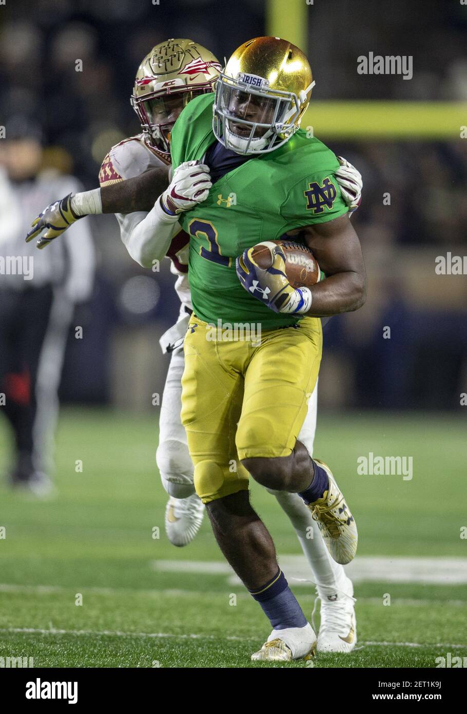 November 10, 2018: Notre Dame running back Dexter Williams (2) runs with  the ball for yardage as Florida State defensive back Cyrus Fagan (24)  defends during NCAA football game action between the