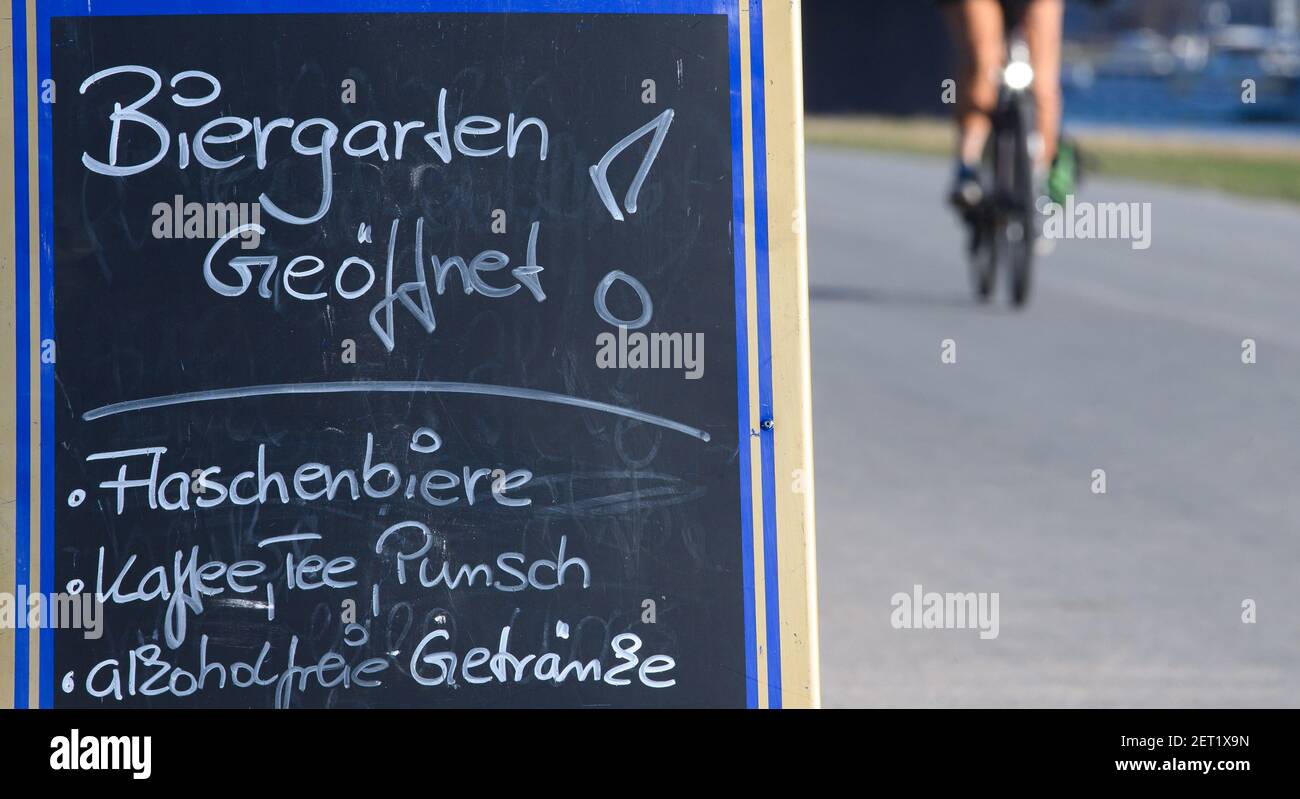 Dresden, Germany. 01st Mar, 2021. A sign 'Biergarten geöffnet' (beer garden open) stands along the Elbe cycle path and advertises, bottled beers, coffee, tea, punch and soft drinks. Credit: Robert Michael/dpa-Zentralbild/ZB/dpa/Alamy Live News Stock Photo