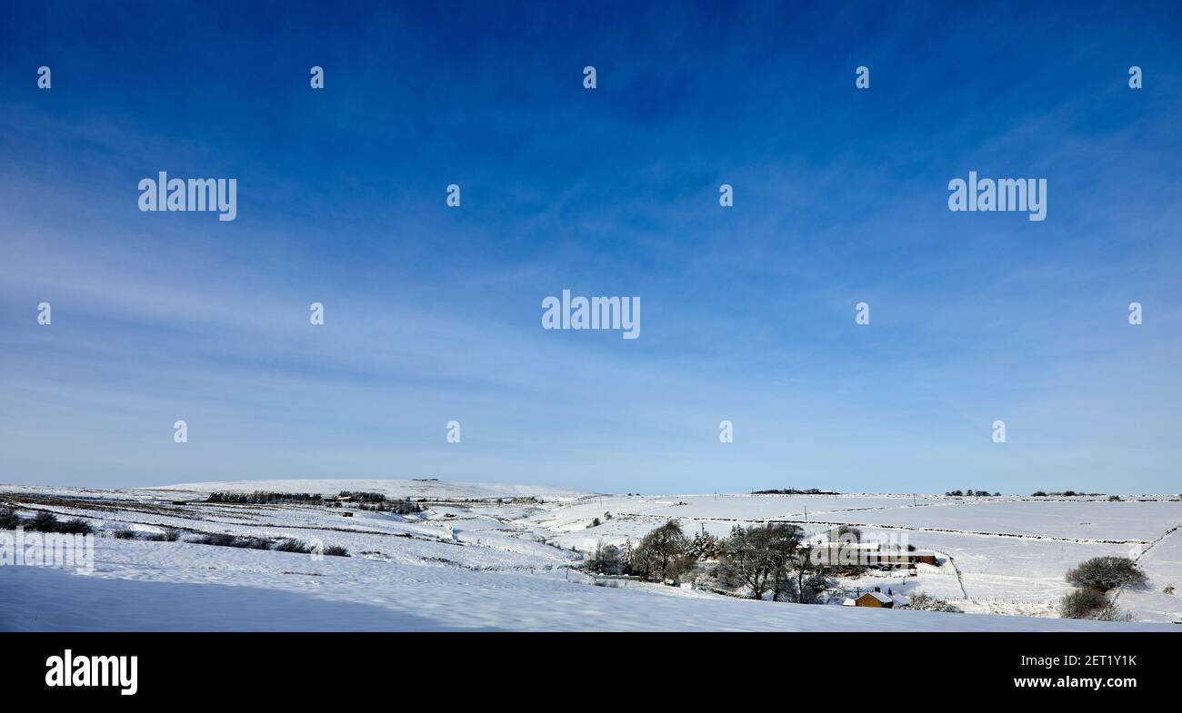 Snow covers a Yorkshire moorland valley at 900ft Stock Photo