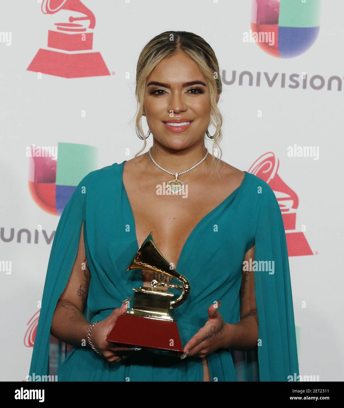 Karol G Poses For A Photo After Winning Best New Artist Award During 