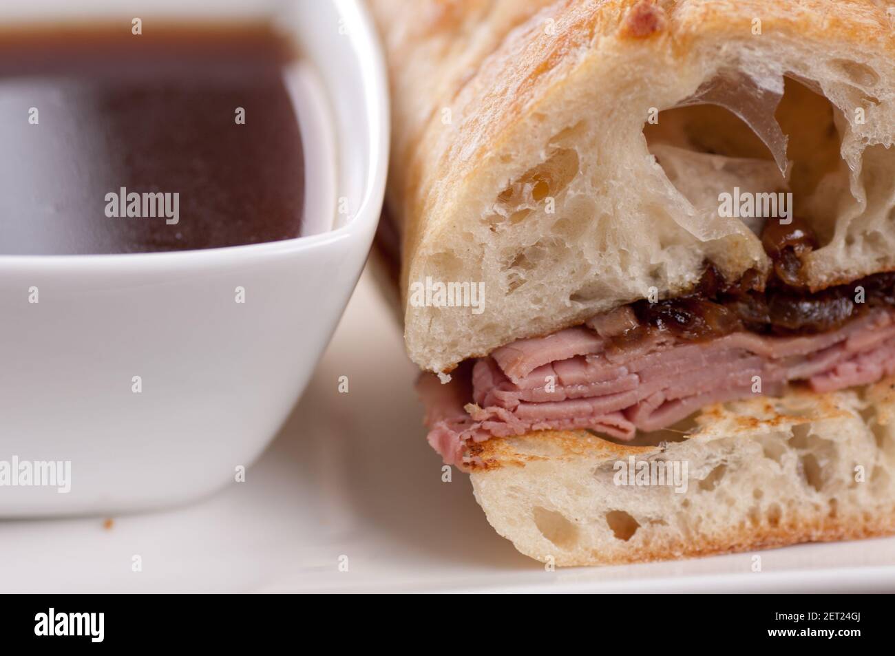 classic french dip au jus or beef dip with fries Stock Photo Alamy