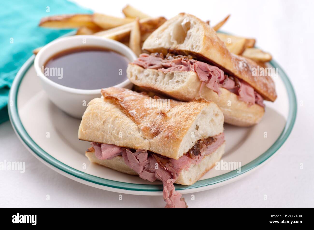 classic french dip au jus or beef dip with fries Stock Photo Alamy