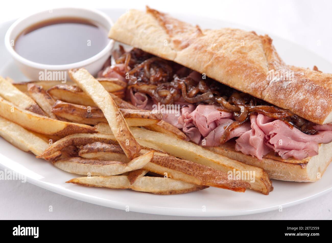 classic french dip au jus or beef dip with fries Stock Photo Alamy