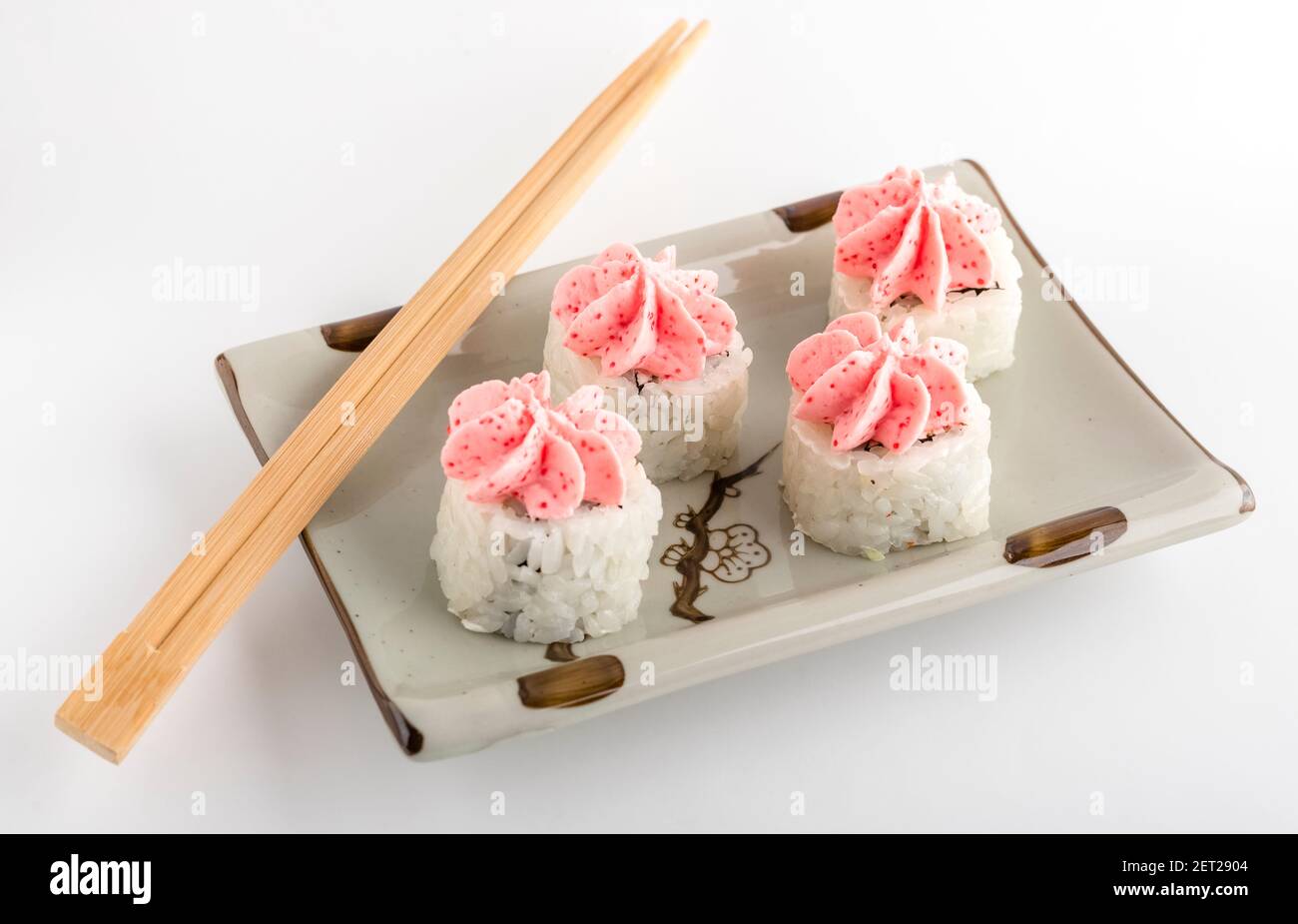 sushi and rolls on a plate. White background. Serving Japanese cuisine Stock Photo