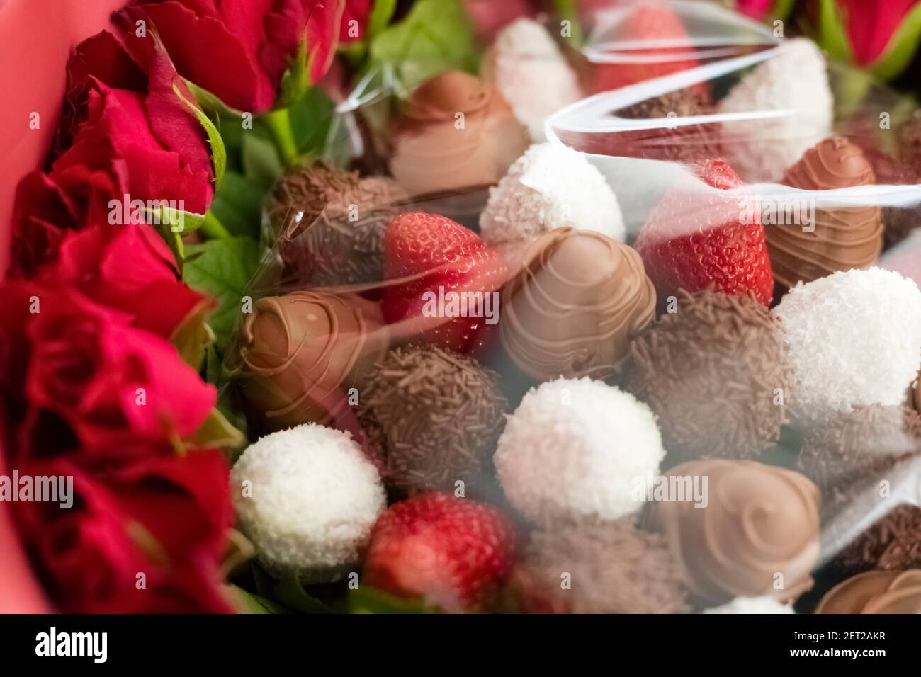 fresh strawberries covered with chocolate and coconut. Stock Photo