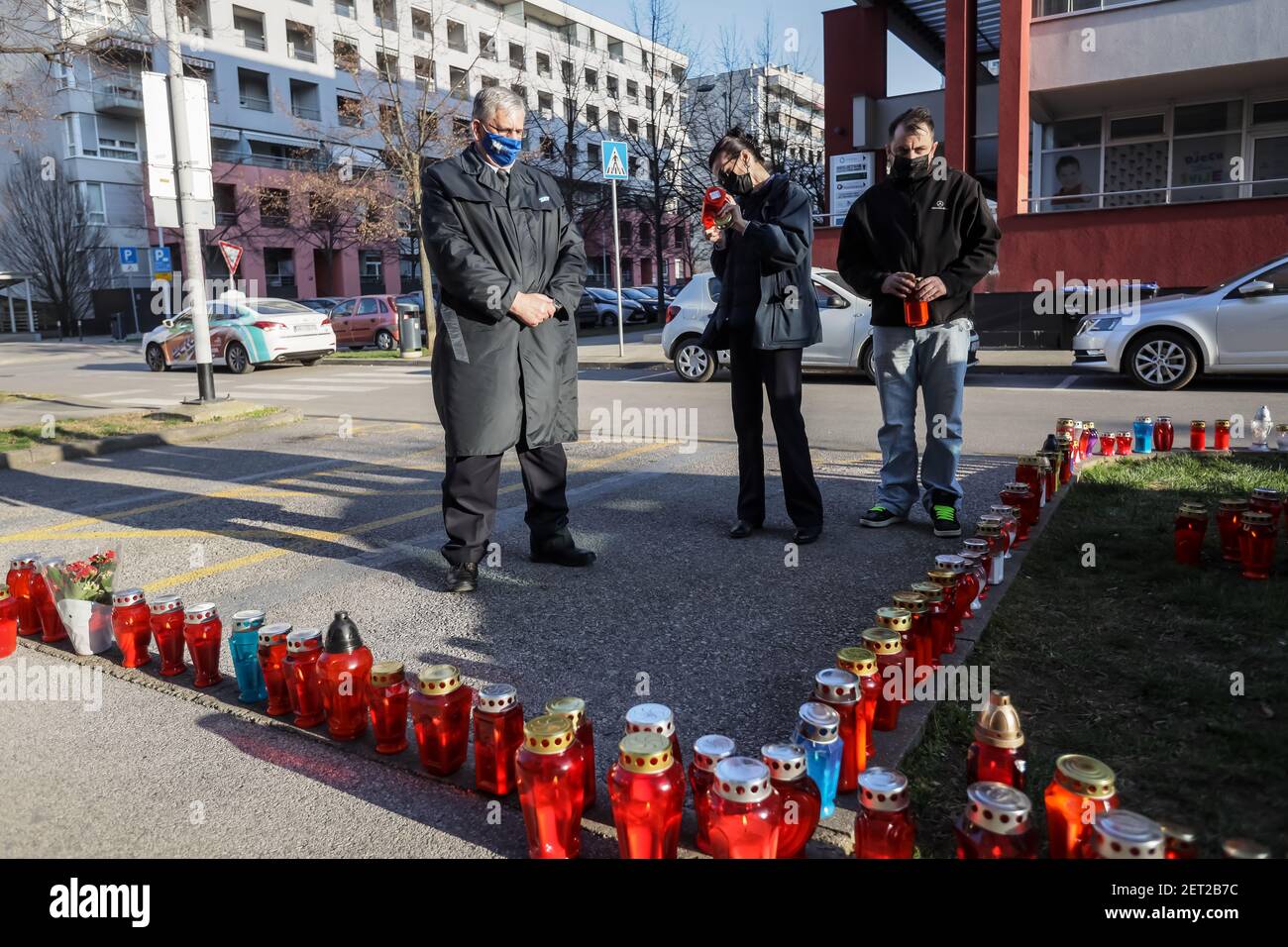 Zagreb, Croatia. 28th Feb, 2021. Due to the death of the mayor of Zagreb, Milan Bandic, citizens light lanterns in front of the building in Buzanova Street, where Mayor Milan Bandic lived. Mayor Milan Bandic died of a heart attack on the night of February 28, 2021. Milan Bandic was mayor for 6 terms and ruled Zagreb for a total of 21 years. Credit: Goran Jakuš/Alamy Live News Stock Photo