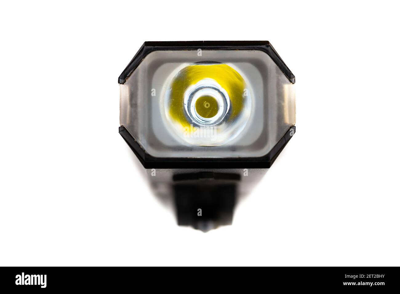 Front LED bicycle light on a white background. Artificial overhead light. Top semi-macro shot Stock Photo