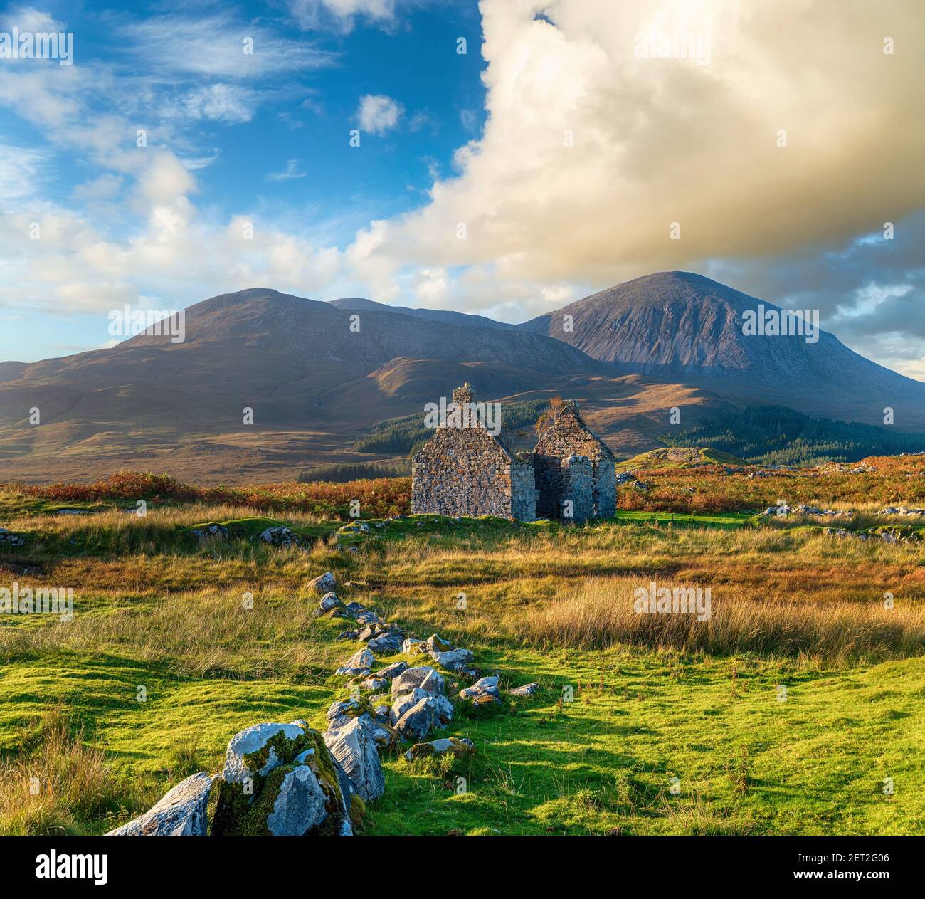 The ruins of the old Manse nestled under the Beinn na Caillich mountain at Killchrist near Broadford on the Isle of Skye in Scotland Stock Photo