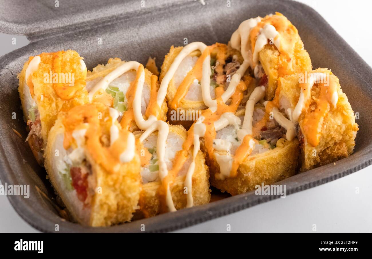 Warm rolls in a food box on a white background. Food delivery concept Stock Photo