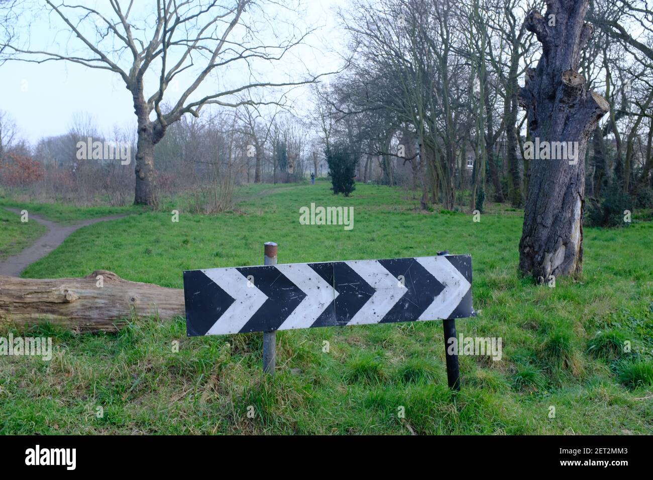 LONDON - 1ST MARCH 2021: A right turn direction chevron on the edge of Wanstead Flats in East London. Stock Photo