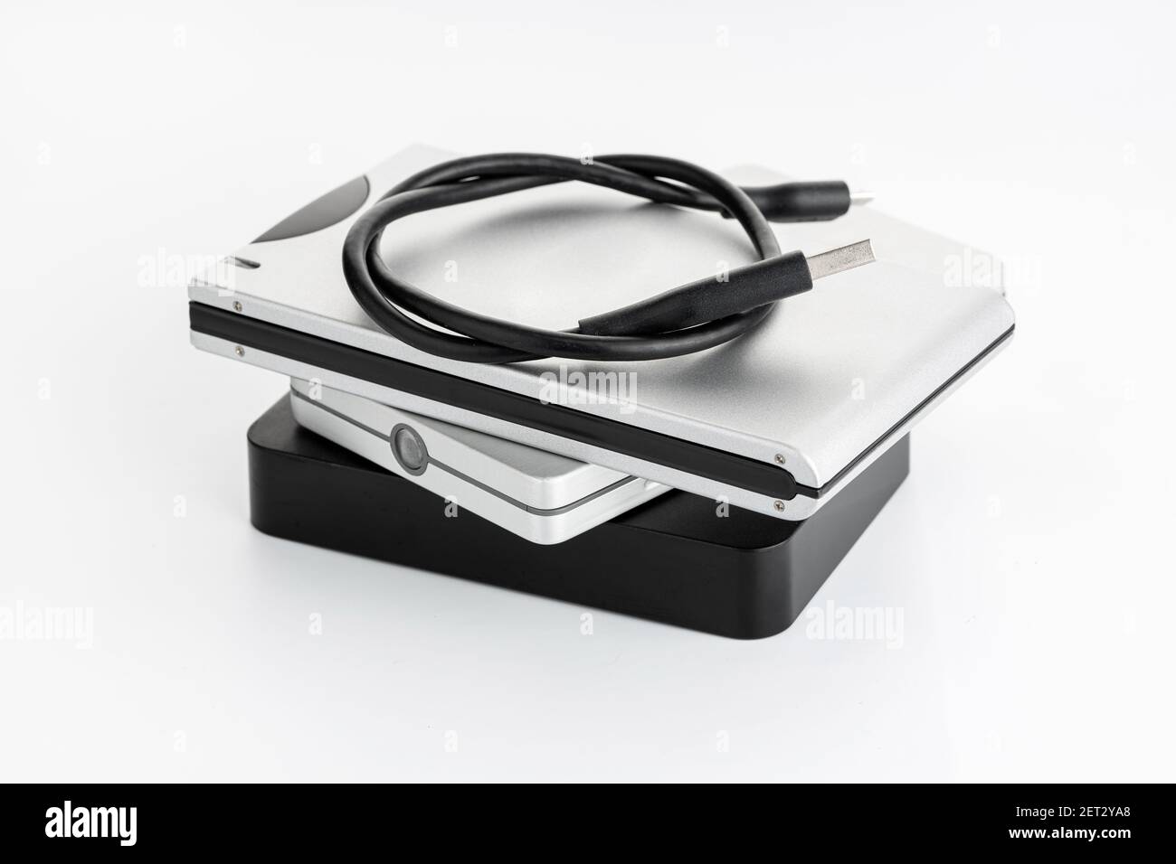 Pile of a group of external Hard disk drive on white table. HDD Data