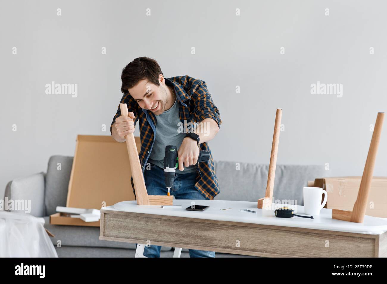 Great purchase, assembly of new furniture at home, housekeeping and good mood Stock Photo