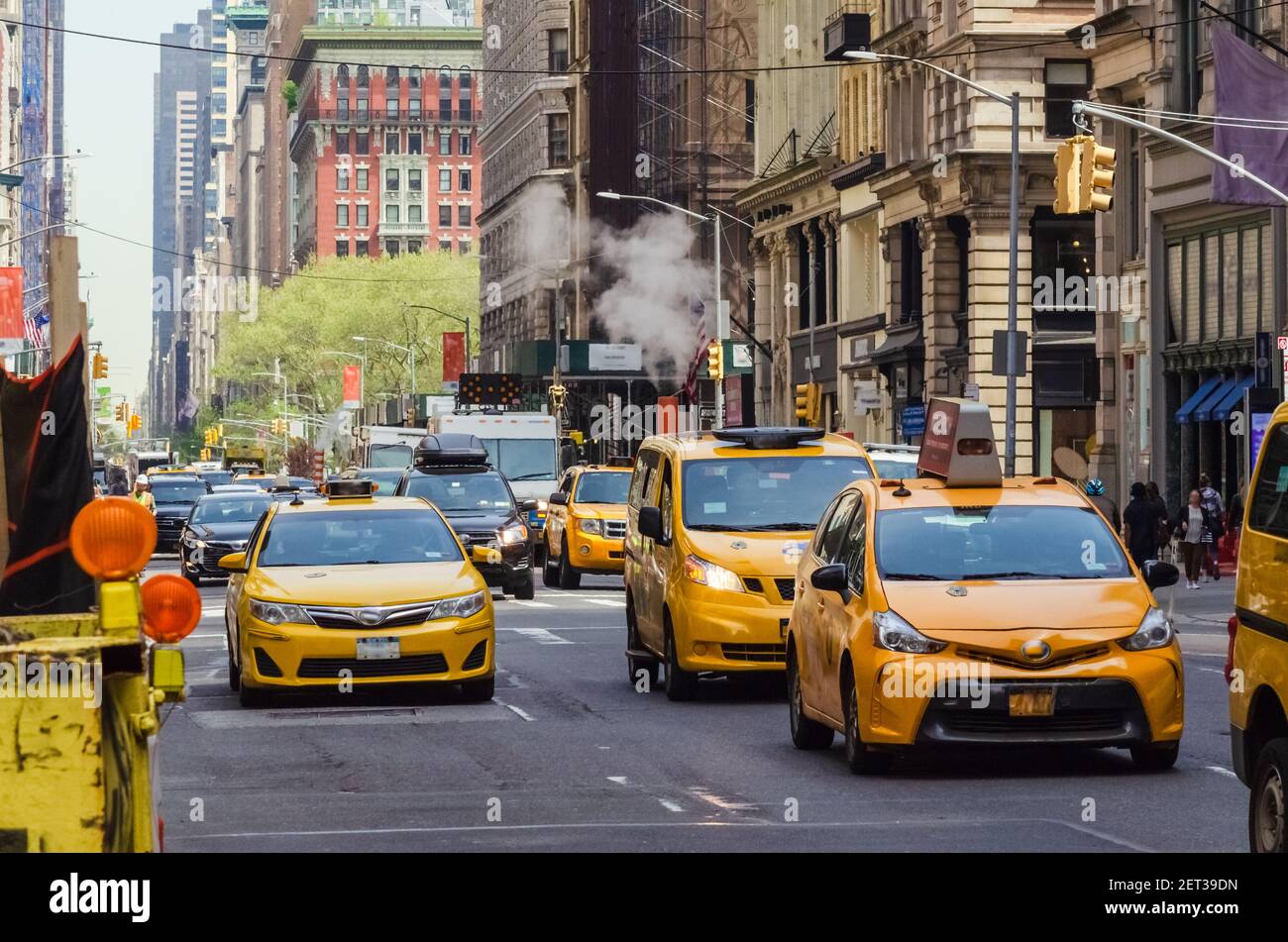 Street view of medallion yellow cabs in Manhattan New York Stock Photo