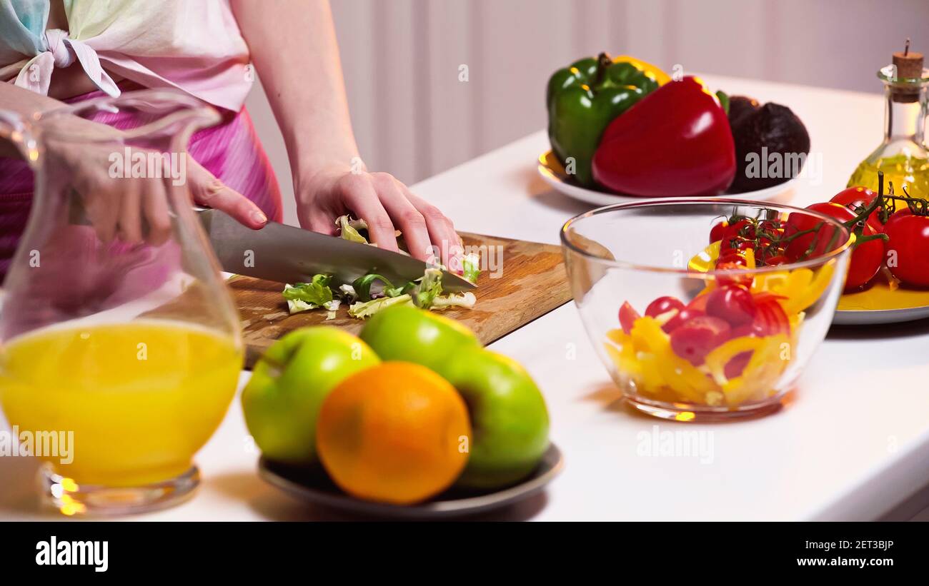 Woman chopping lettuce on board hi-res stock photography and images - Alamy