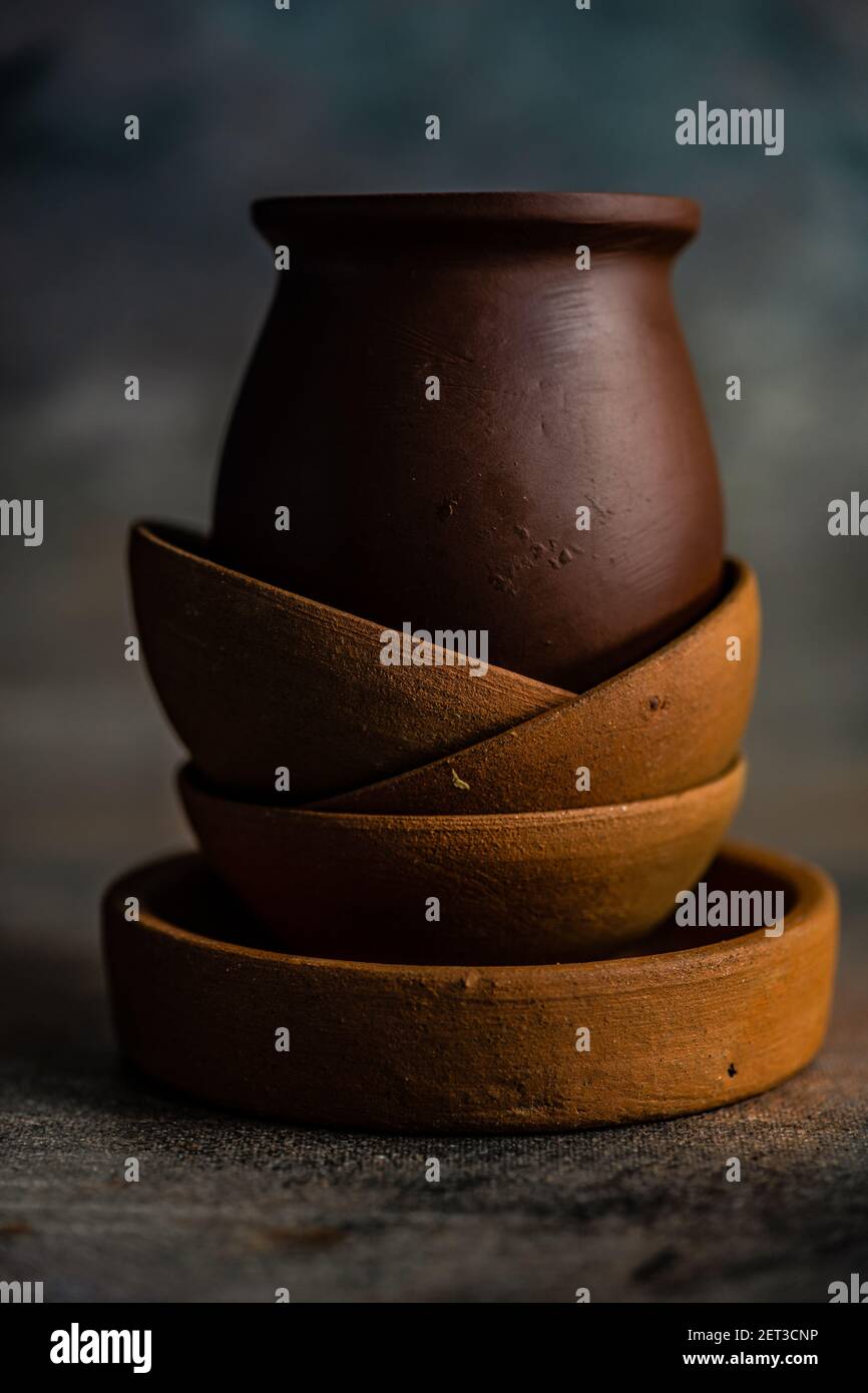 Stack of rustic bowls on a table on a wooden table Stock Photo