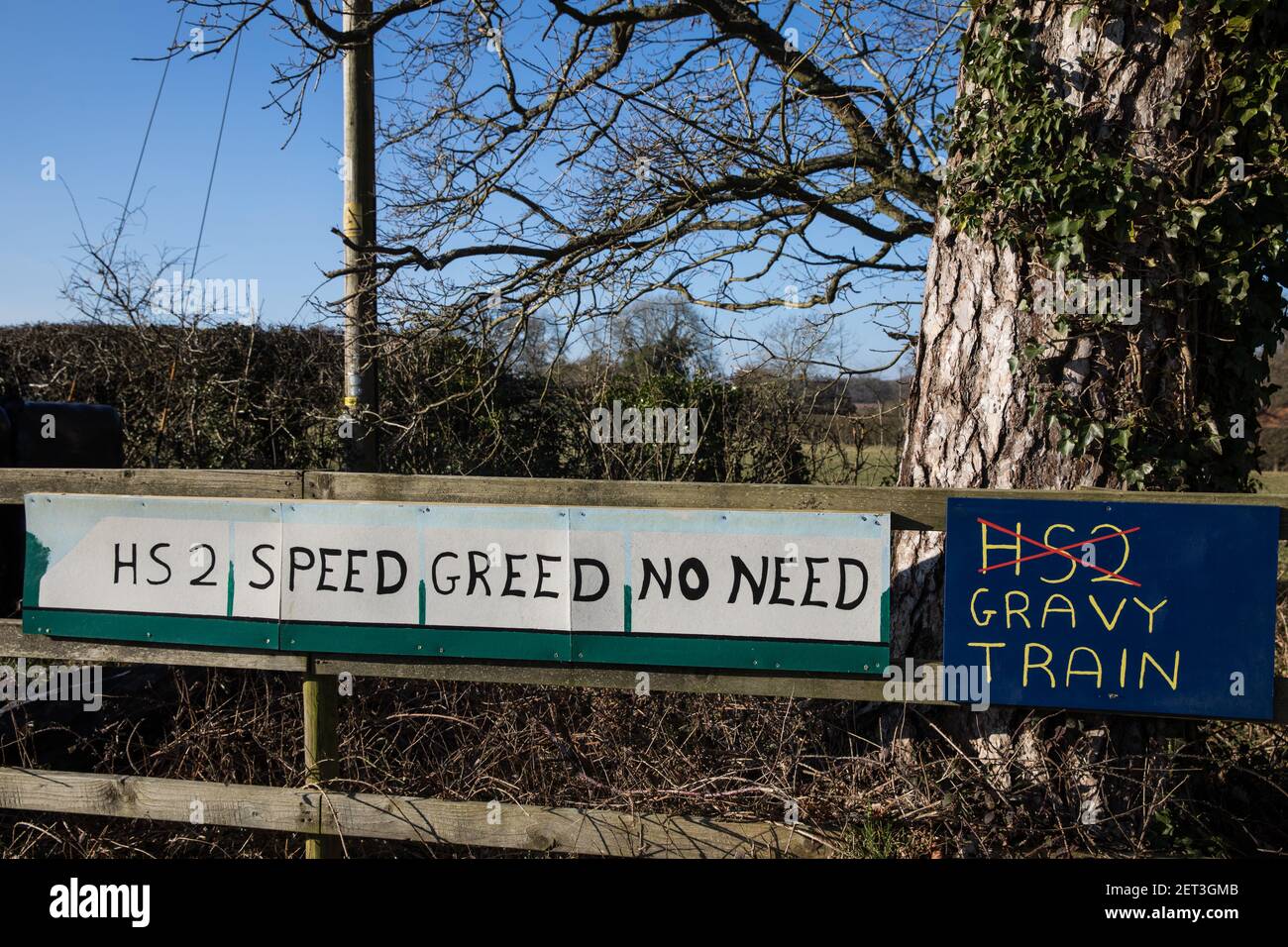 Great Missenden, UK. 28th February, 2021. Anti-HS2 signs are pictured outside a farm in the Chilterns. Local residents and environmental activists continue to show their opposition to the destruction of ancient woodland, trees and hedgerows in the the Chilterns, which is an Area of Outstanding Natural Beauty. Credit: Mark Kerrison/Alamy Live News Stock Photo