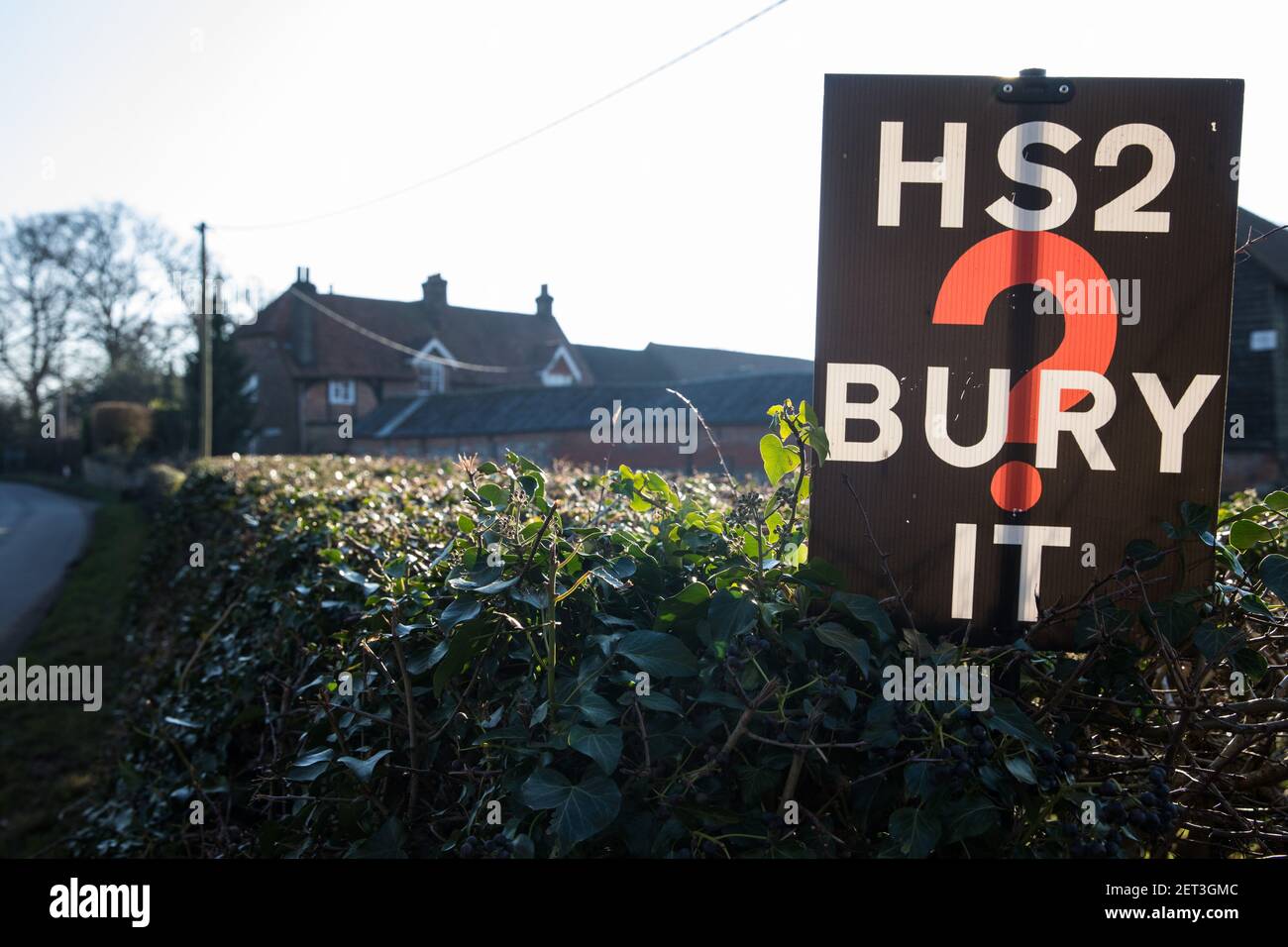 Great Missenden, UK. 28th February, 2021. An anti-HS2 sign is pictured outside a farm in the Chilterns. Local residents and environmental activists continue to show their opposition to the destruction of ancient woodland, trees and hedgerows in the the Chilterns, which is an Area of Outstanding Natural Beauty. Credit: Mark Kerrison/Alamy Live News Stock Photo