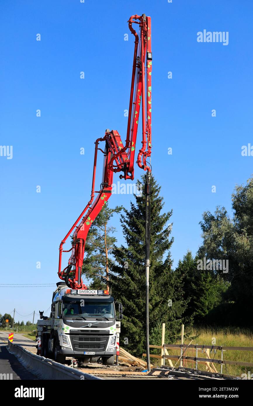 Putzmeister truck mounted concrete pump of Swerock at work site on a bridge over Paimionjoki river. Road 224, Marttila, Finland. August 21, 2020. Stock Photo