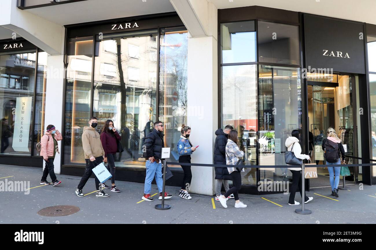 Shoppers queue in front of a re-opened Zara clothing store after the Swiss  government relaxed some of its COVID-19 restrictions, as the spread of the  coronavirus disease continues, at the Bahnhofstrasse shopping