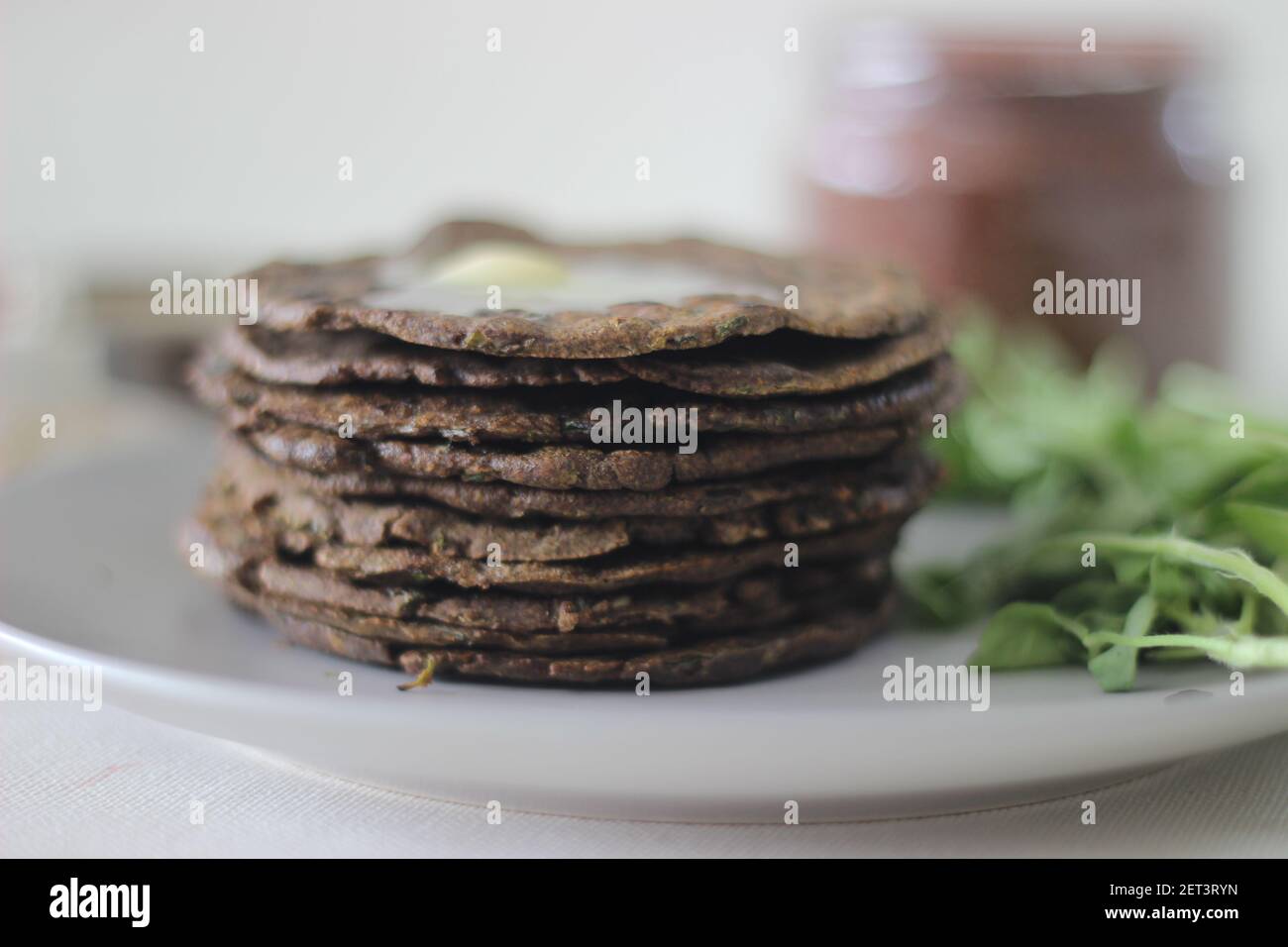 Flatbread with finger millet and fenugreek leaves served with masala curd. It is also called