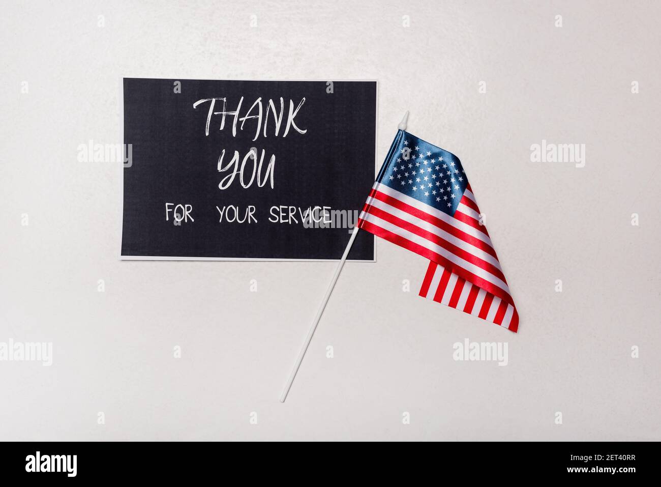 Top view of card with thank you for your service lettering and american ...