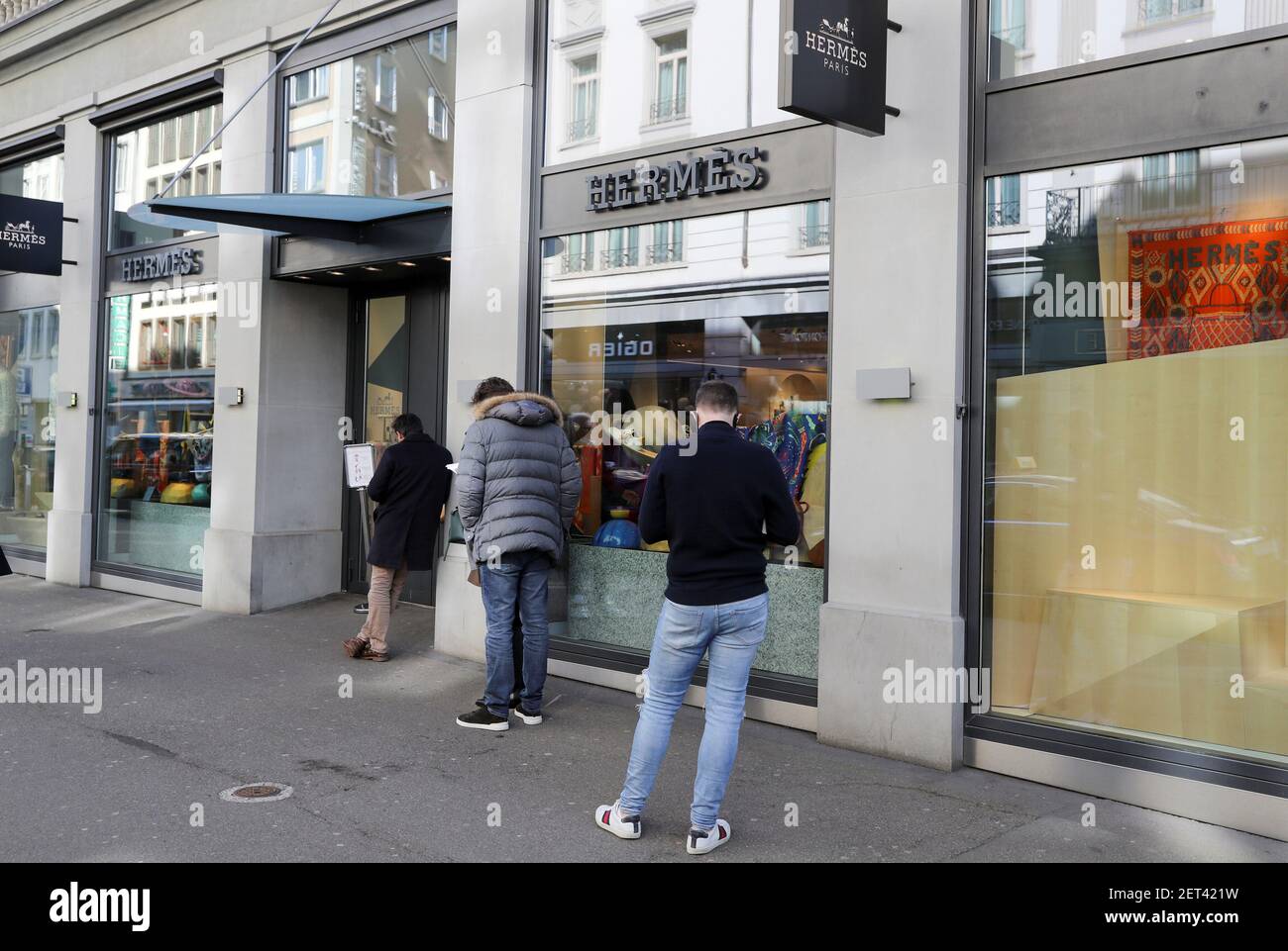 Shoppers queue in front of a re-opened store of French luxury house Hermes  after the Swiss government relaxed some of its COVID-19 restrictions, as  the spread of the coronavirus disease (COVID-19) continues,