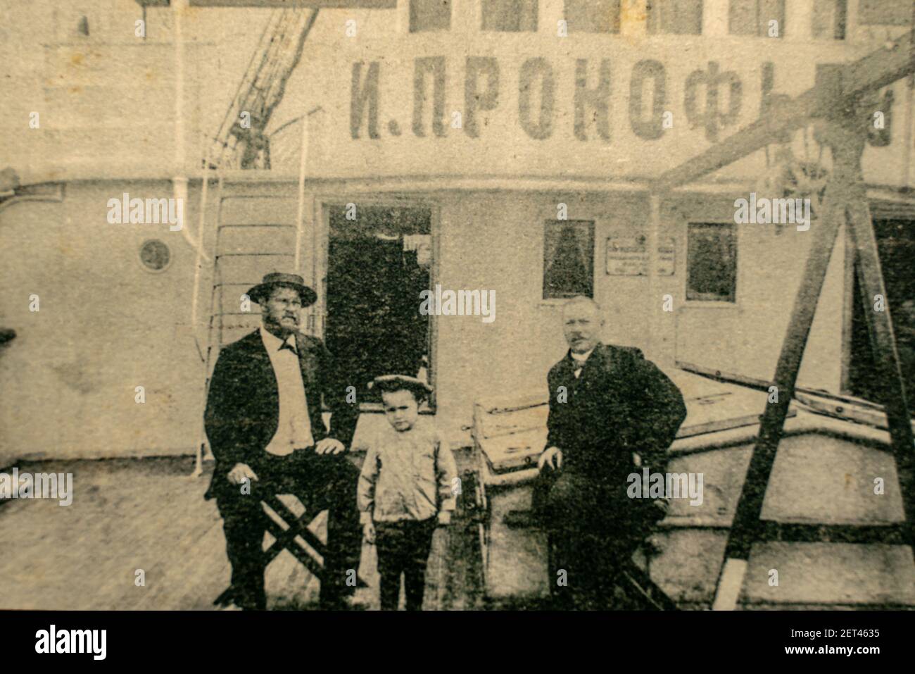 Russia, Caspian Sea - CIRCA 1910-1917: Family members of a ship crew posing on the Ivan Prokofjev oil tanker ship which was used for transporting unre Stock Photo