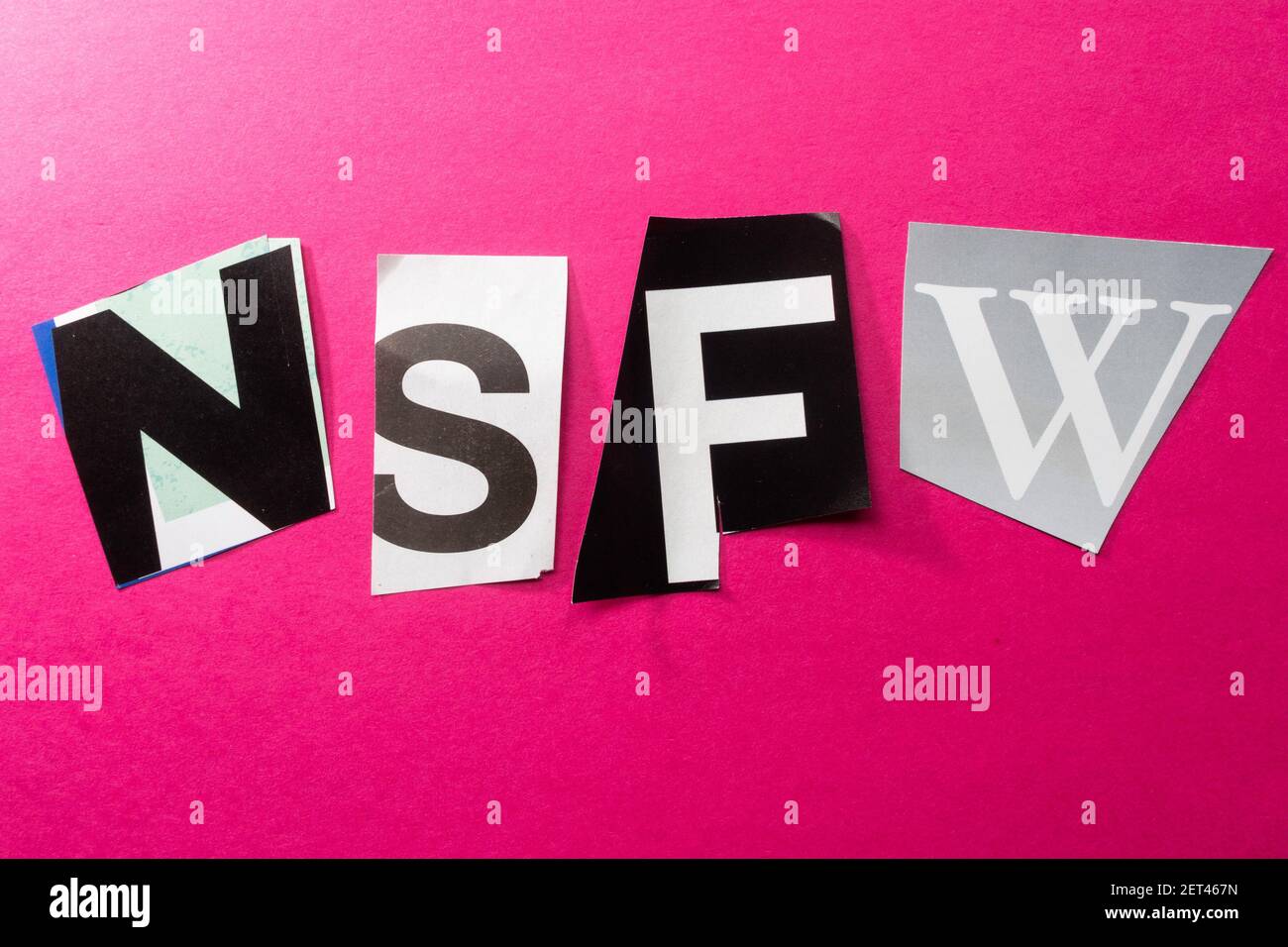The acronym NSFW is short for 'Not Suitable For Work' and is spelled out in ransom note style topography, USA Stock Photo